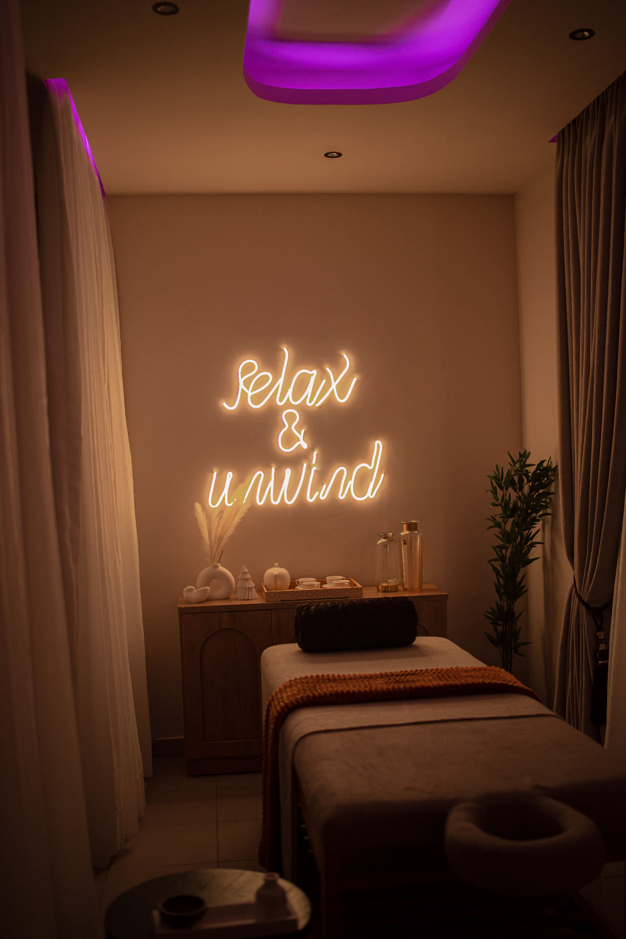 Guest relaxing in a private lounge between massage sessions in Lekki